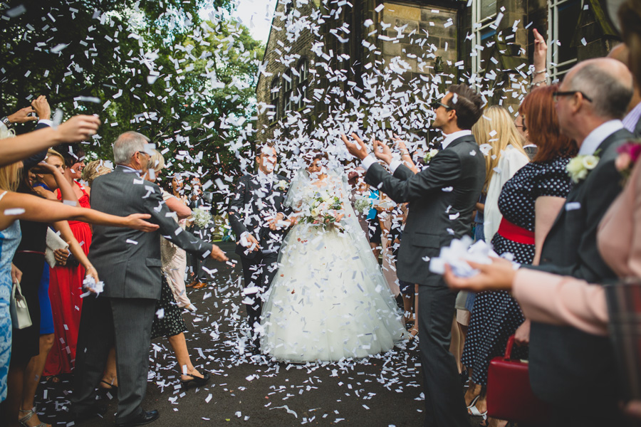 the bride and groom confetti canon photo