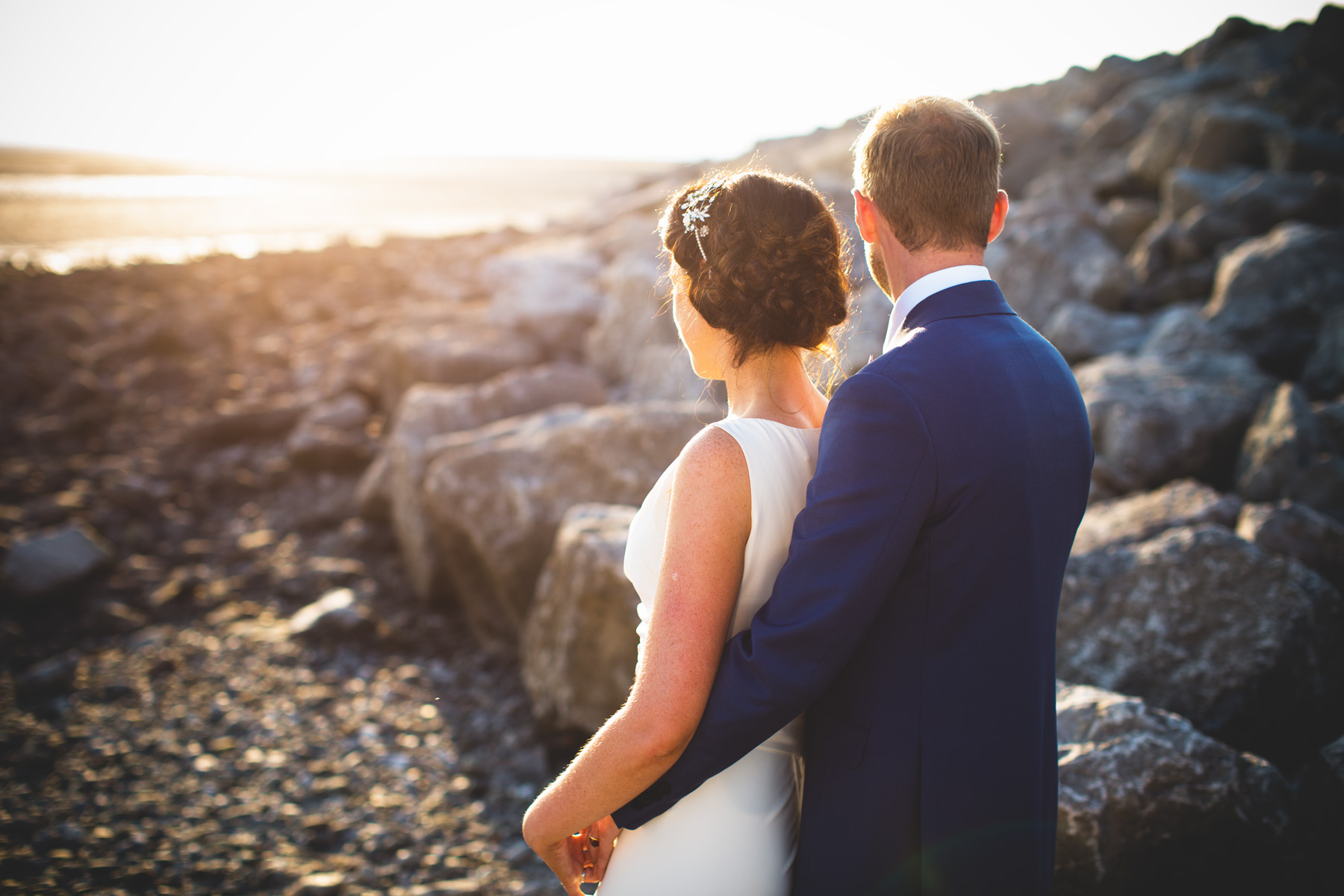 natural wedding photography portrait of bride and groom at sunset