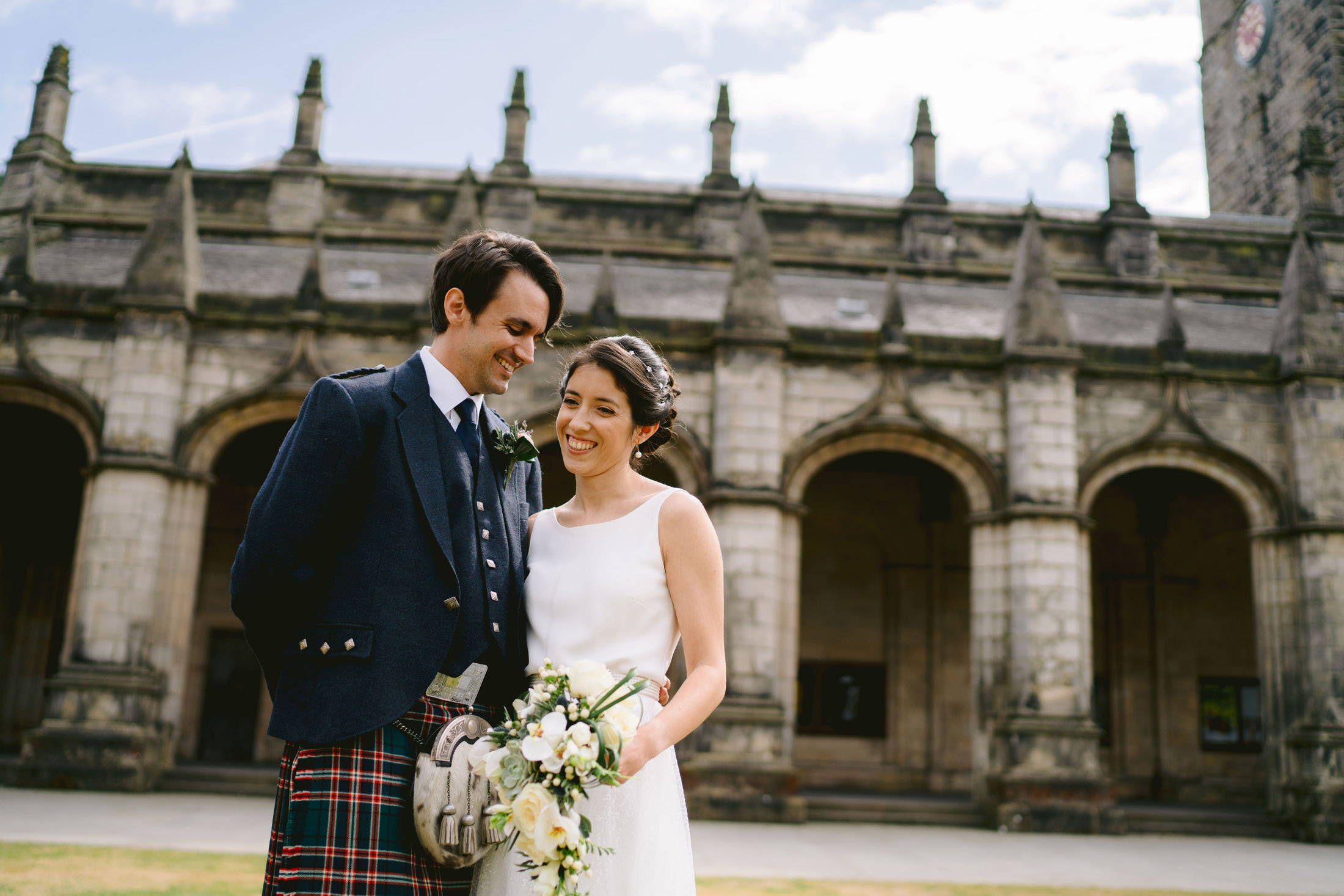 the bride and groom at st salvator's chapel and quad at their the old course hotel wedding