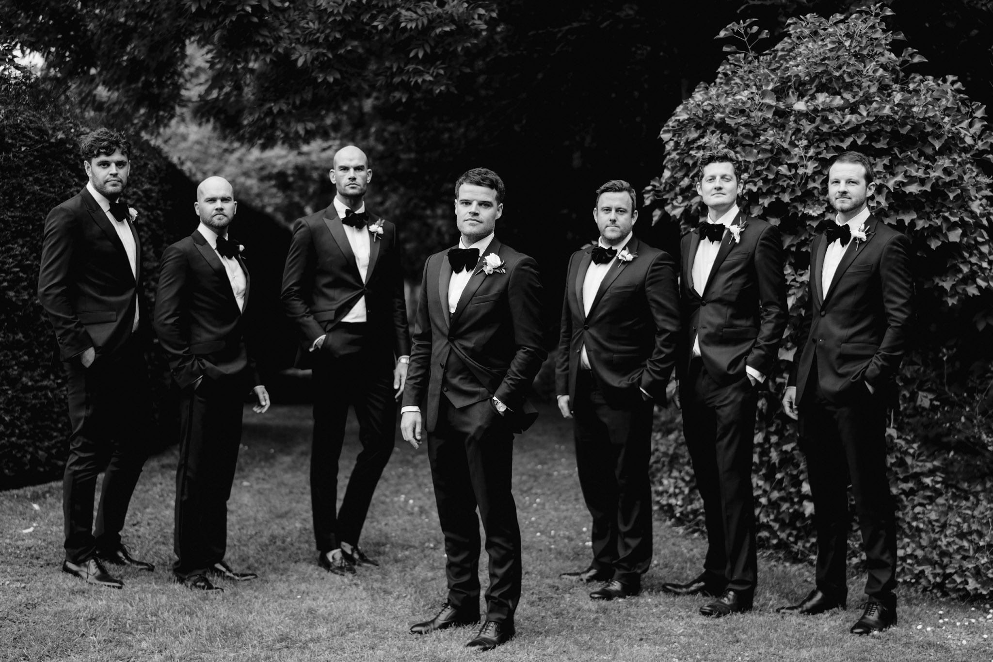 grooms preparation photo in black and white of groomsmen at the wedding